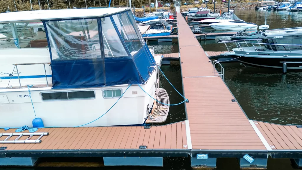 A new dock from Harrison Hot Springs Marina on Harrison Lake. Boats are moored on the dock.